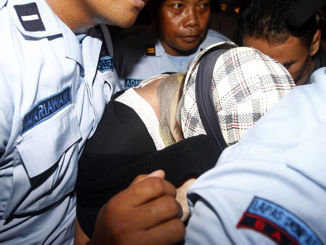 Schapelle Corby is escorted by prison guards to the prosecutor office after receiving parole